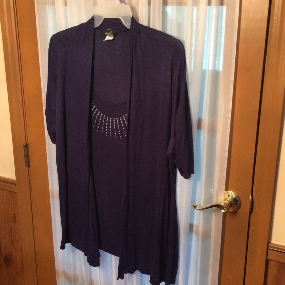 95%Rayon  5% spandex dark navy rhinestone around neck. Machine wash
